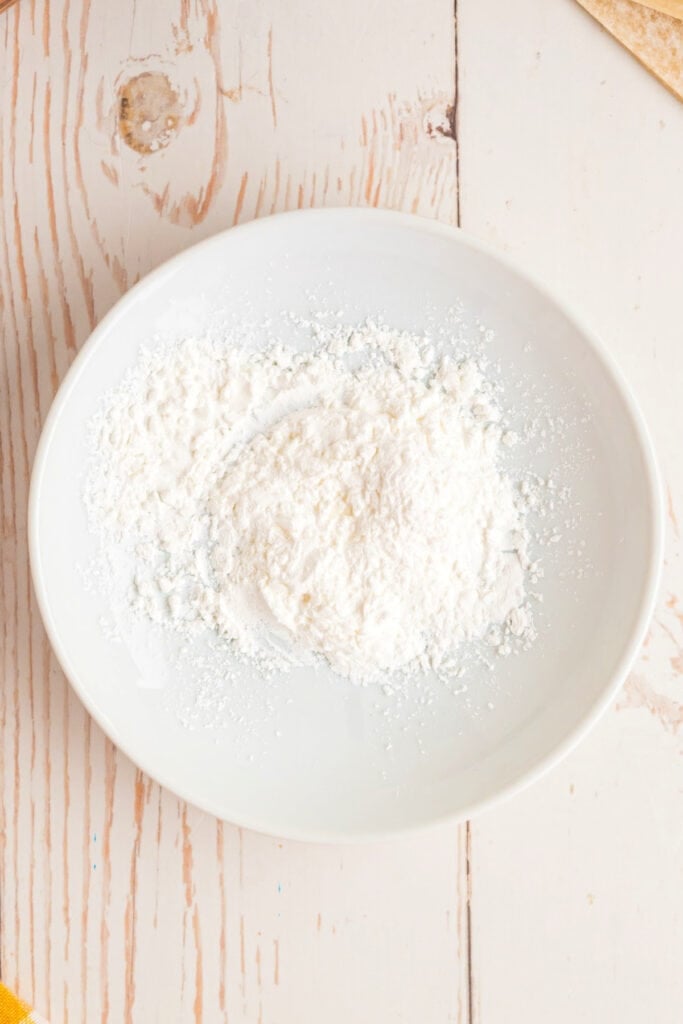 cornstarch in a bowl for slurry used to seal Big Mac Egg Rolls