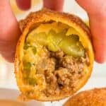close up of cut Big Mac Egg Roll showing ground beef, pickles, and melted cheese inside