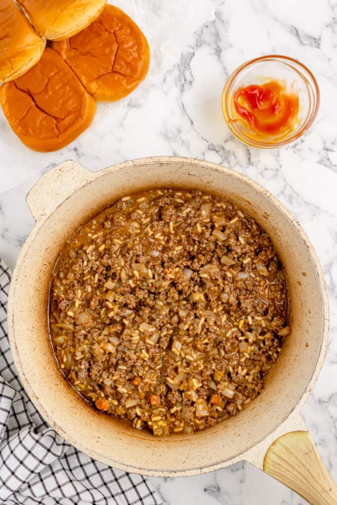 sloppy joe mixture simmering in a skillet with ground beef, onions, and rice from gumbo soup