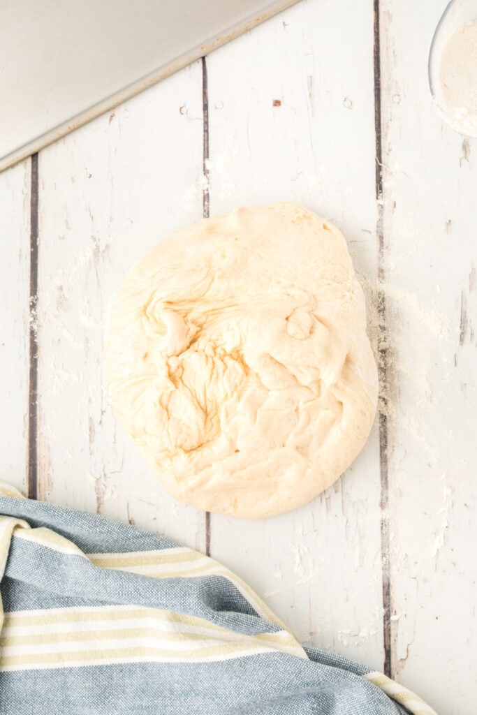 homemade onion rolls dough turned out onto a lightly floured surface