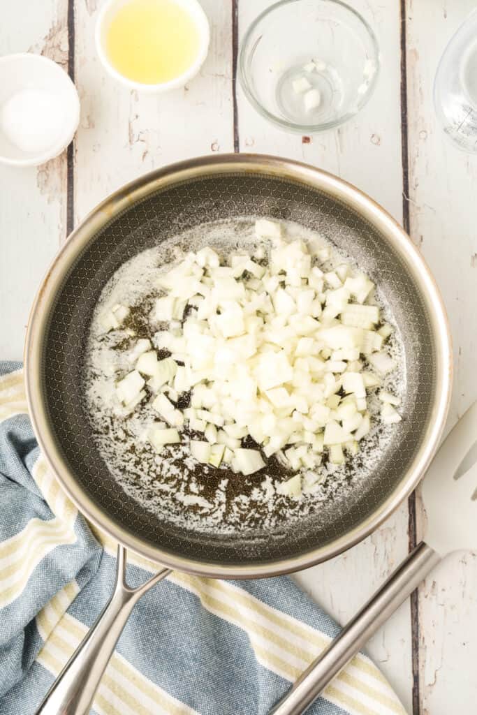 chopped onion added to melted butter in a skillet