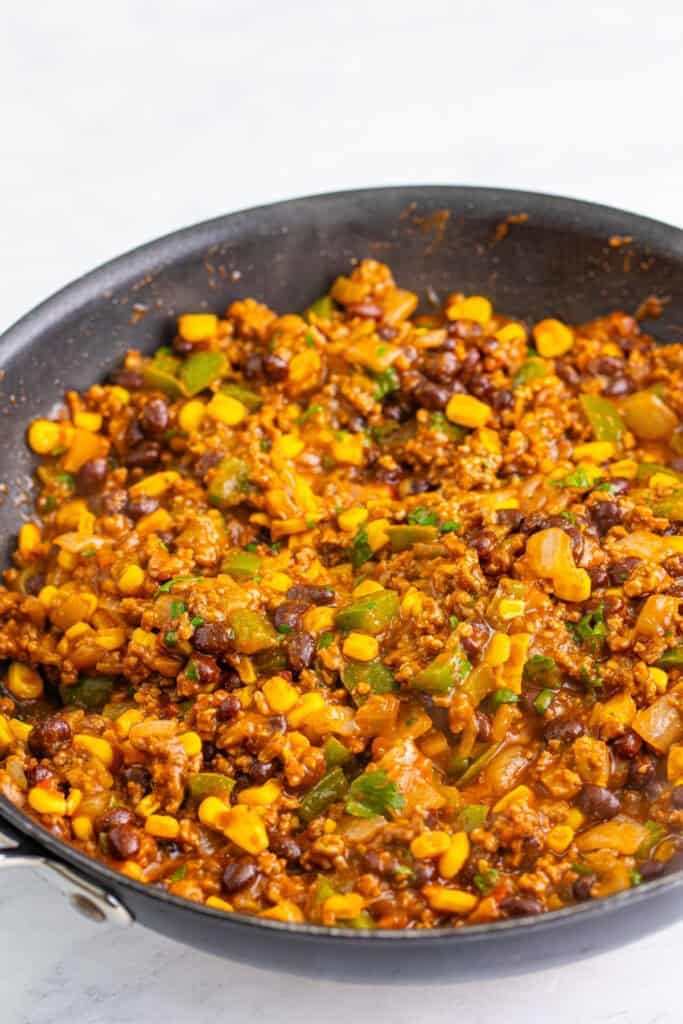 finished Taco Sloppy Joes mixture cooked in skillet with ground beef, beans, corn, and peppers