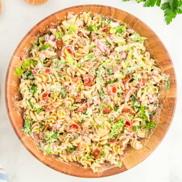 square image of BBQ Ranch BLT Pasta Salad in a bowl with rotini pasta, bacon, lettuce, tomatoes, and creamy BBQ ranch dressing