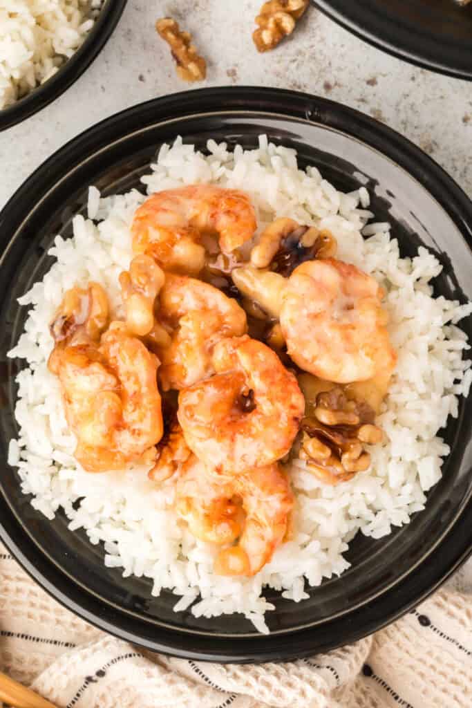 Close-up of creamy Honey Walnut Shrimp with candied walnuts