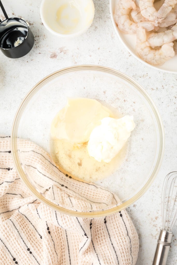 Mayonnaise, honey, sweetened condensed milk, and lemon juice in a bowl for Honey Walnut Shrimp sauce