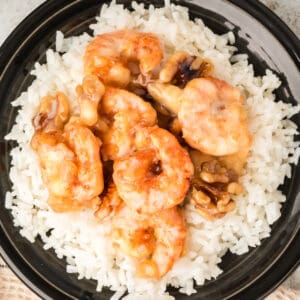 Honey Walnut Shrimp served over white rice with creamy sauce and candied walnuts