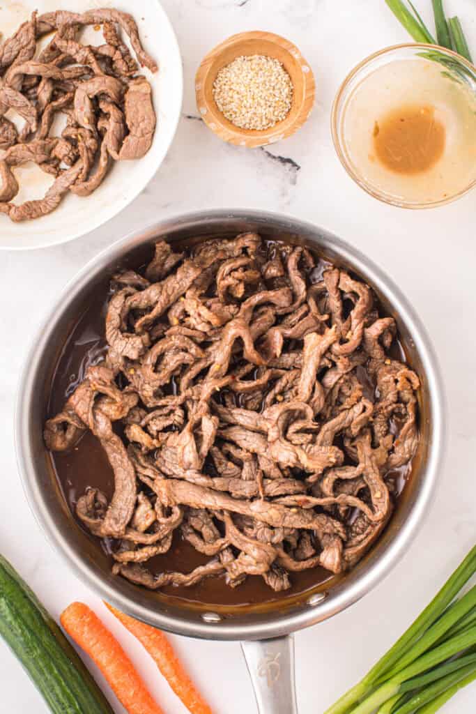 Korean Beef Bulgogi with cooked beef strips and thickened savory bulgogi sauce in a skillet