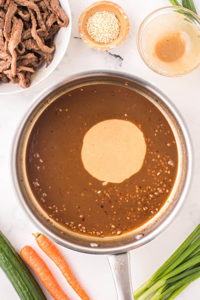 Cornstarch slurry added to bulgogi sauce in a skillet while making Korean Beef Bulgogi
