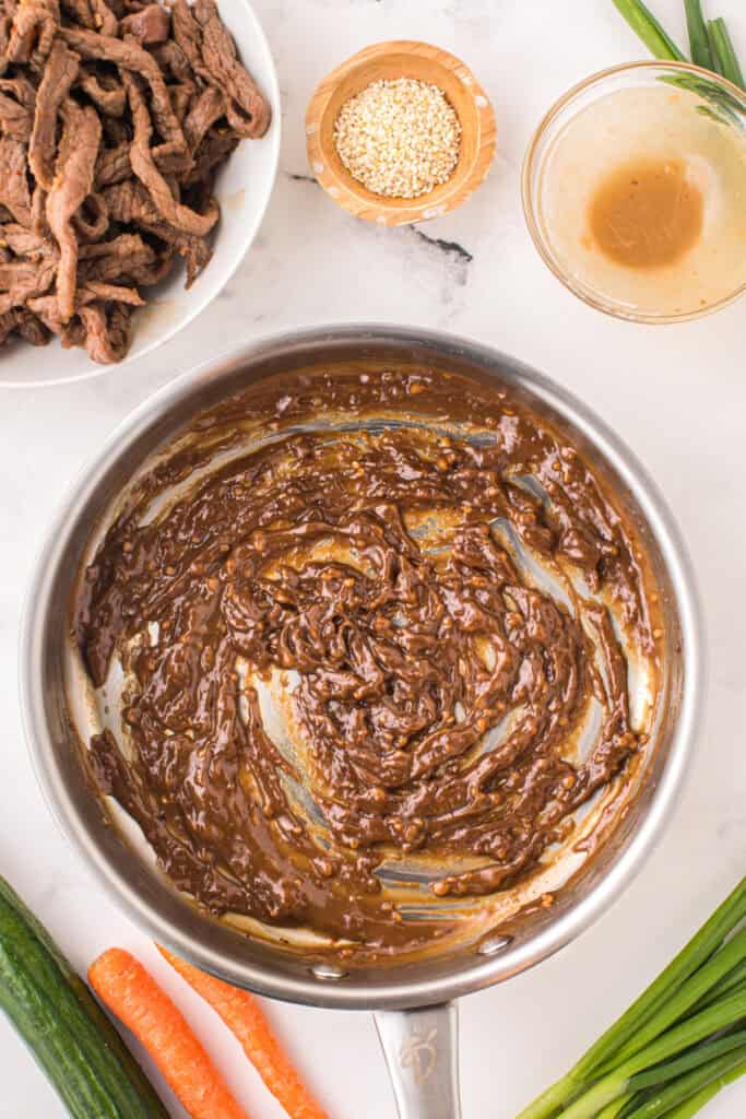 Thickened bulgogi sauce cooking in a skillet for Korean Beef Bulgogi