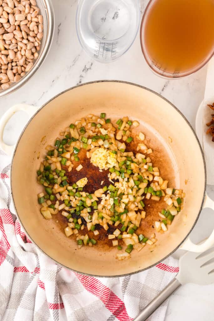 Garlic added to sautéed onion and jalapeño for Ranchero Beans