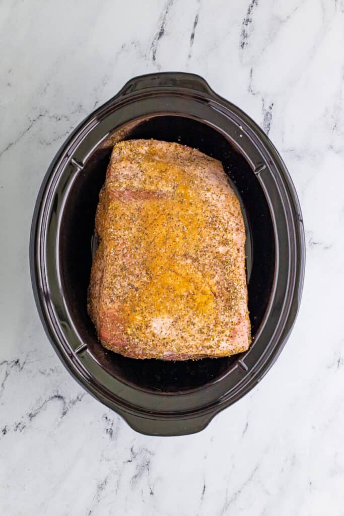 Seasoned pork shoulder in slow cooker for Slow Cooker Carnitas