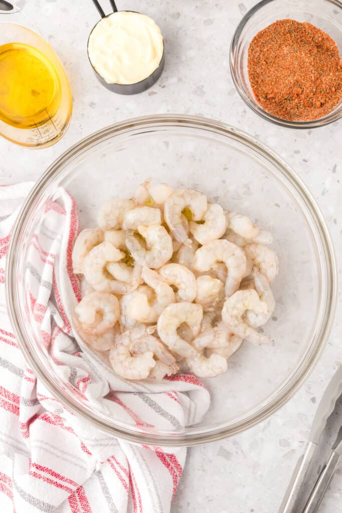 Raw shrimp tossed with oil before seasoning