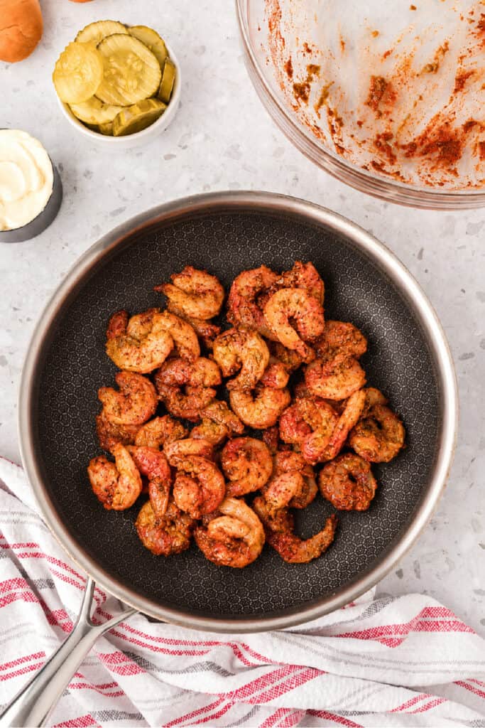 Raw barbecue shrimp in a skillet