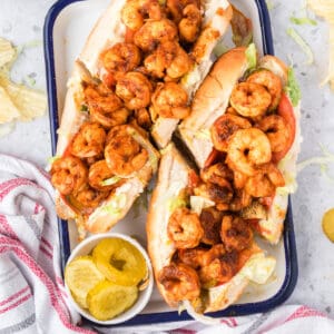 Barbecue Shrimp Po'boy sandwiches topped with seasoned shrimp and fresh vegetables