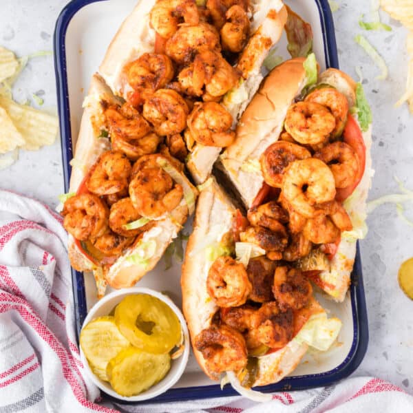 Barbecue Shrimp Po'boy sandwiches topped with seasoned shrimp and fresh vegetables