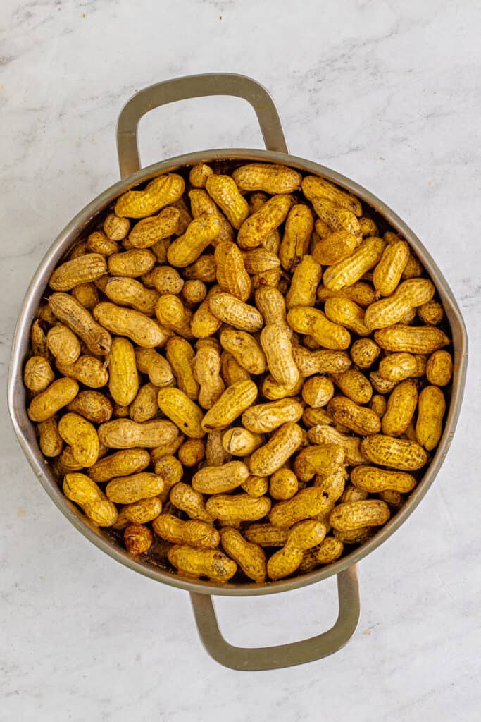 Raw peanuts covered with seasoning before adding enough water to cook.