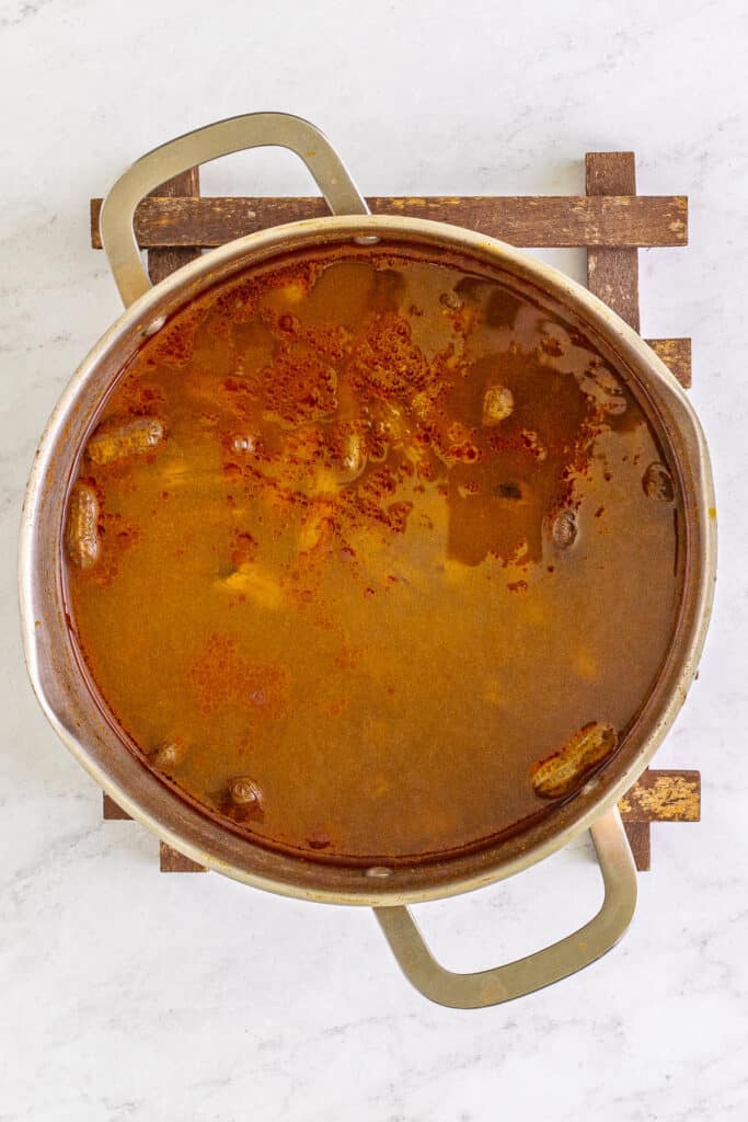 Creole Boiled Peanuts simmering in seasoned cooking liquid.