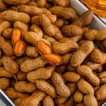 Close-up of homemade Creole Boiled Peanuts with opened shells showing the tender peanuts inside.