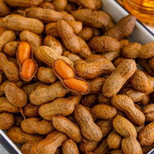 Close-up of homemade Creole Boiled Peanuts with opened shells showing the tender peanuts inside.