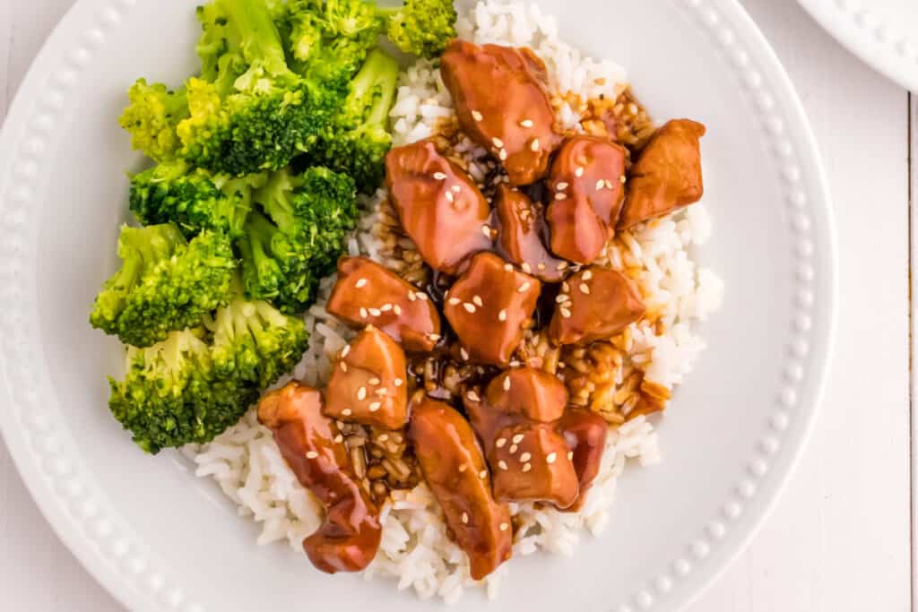 Mongolian Pork bowl with steamed rice, broccoli, and sesame seeds