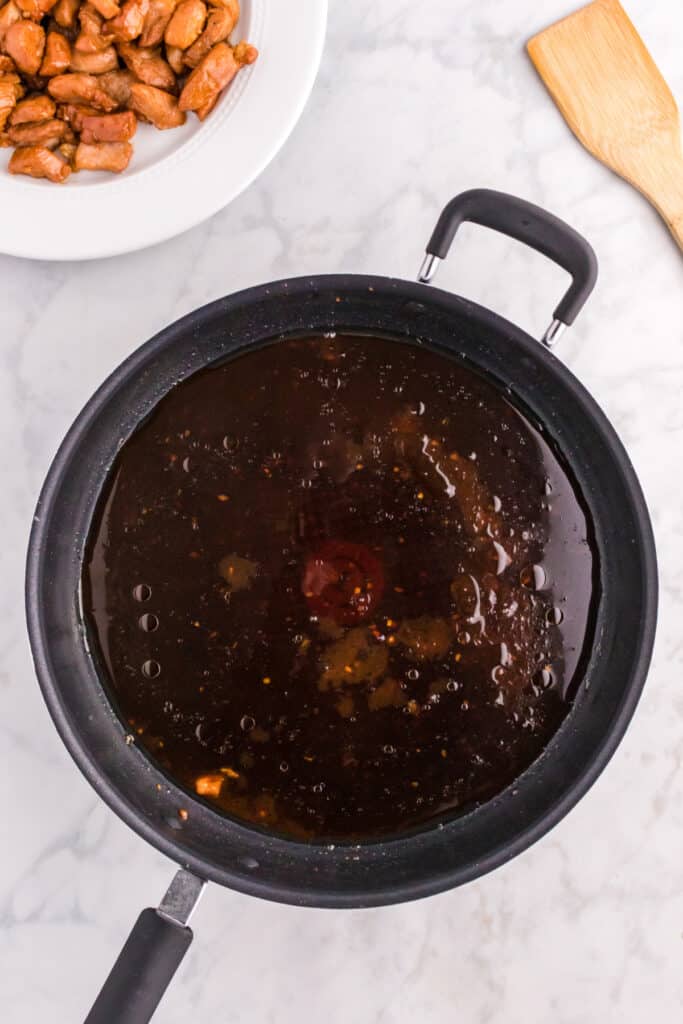 Reserved Mongolian Pork sauce simmering in a skillet
