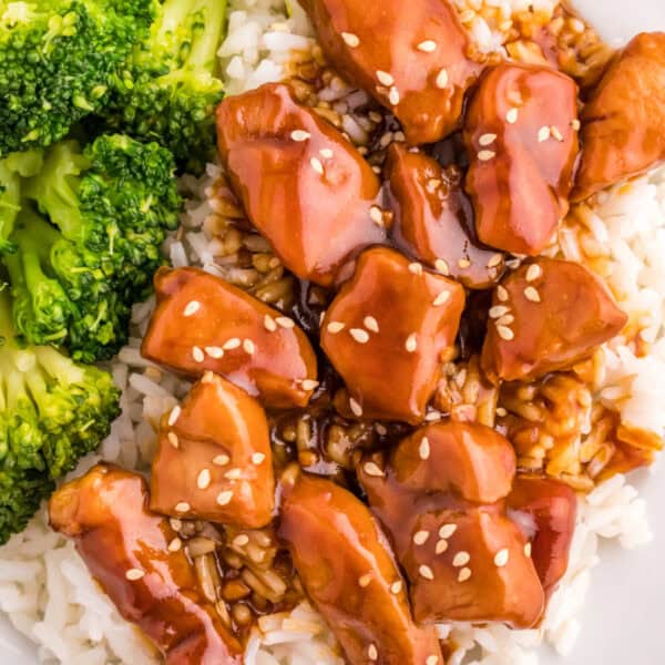 Close-up of Mongolian Pork with glossy sauce over steamed rice