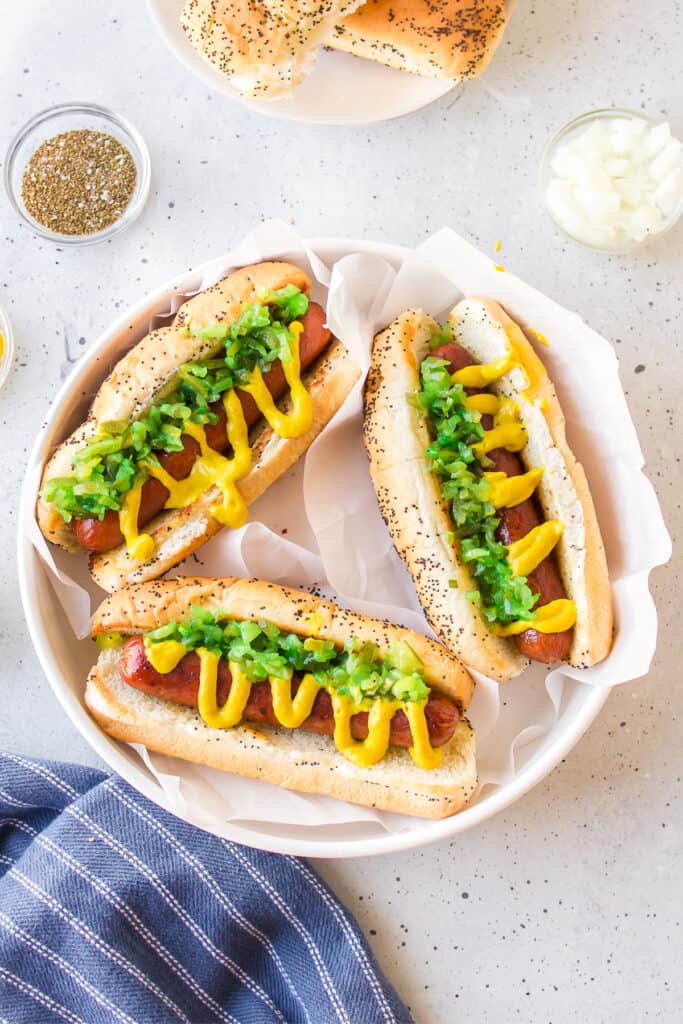 Chicago Hot Dogs topped with yellow mustard and bright green sweet relish