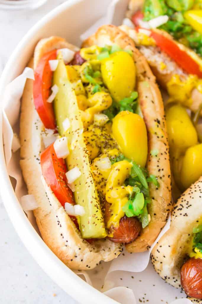 Close-up of a homemade Chicago Dog with classic Chicago-style toppings on a poppy seed bun