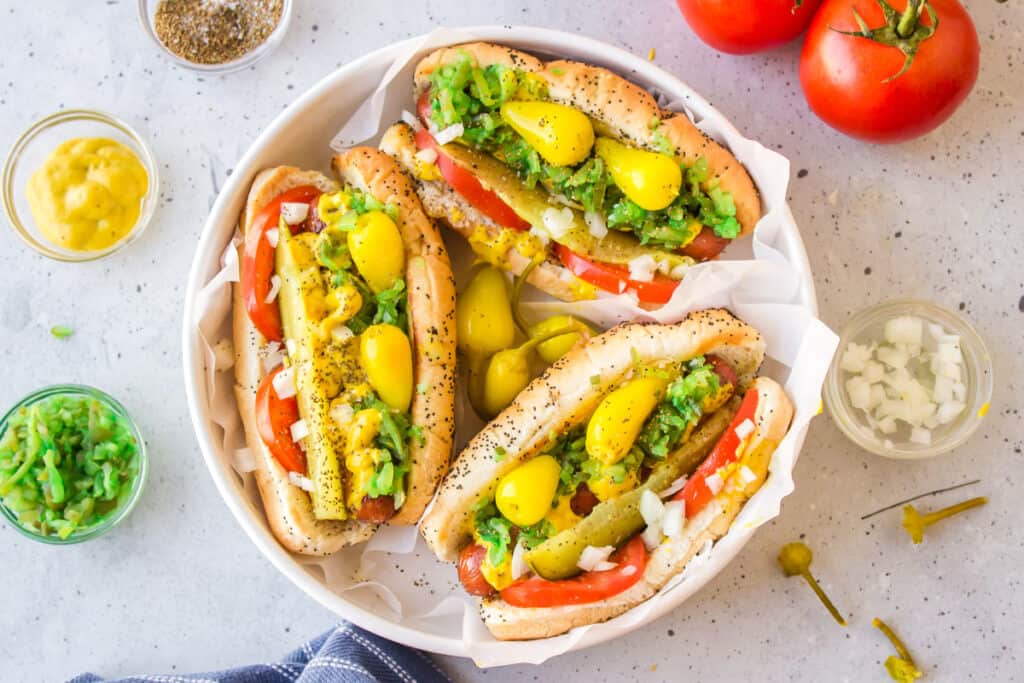 Authentic Chicago Hot Dogs with all the classic toppings served on poppy seed buns