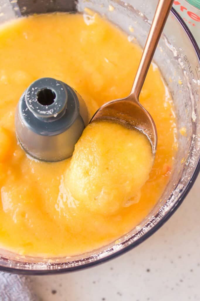 Close-up of the smooth frozen peach mixture after blending.
