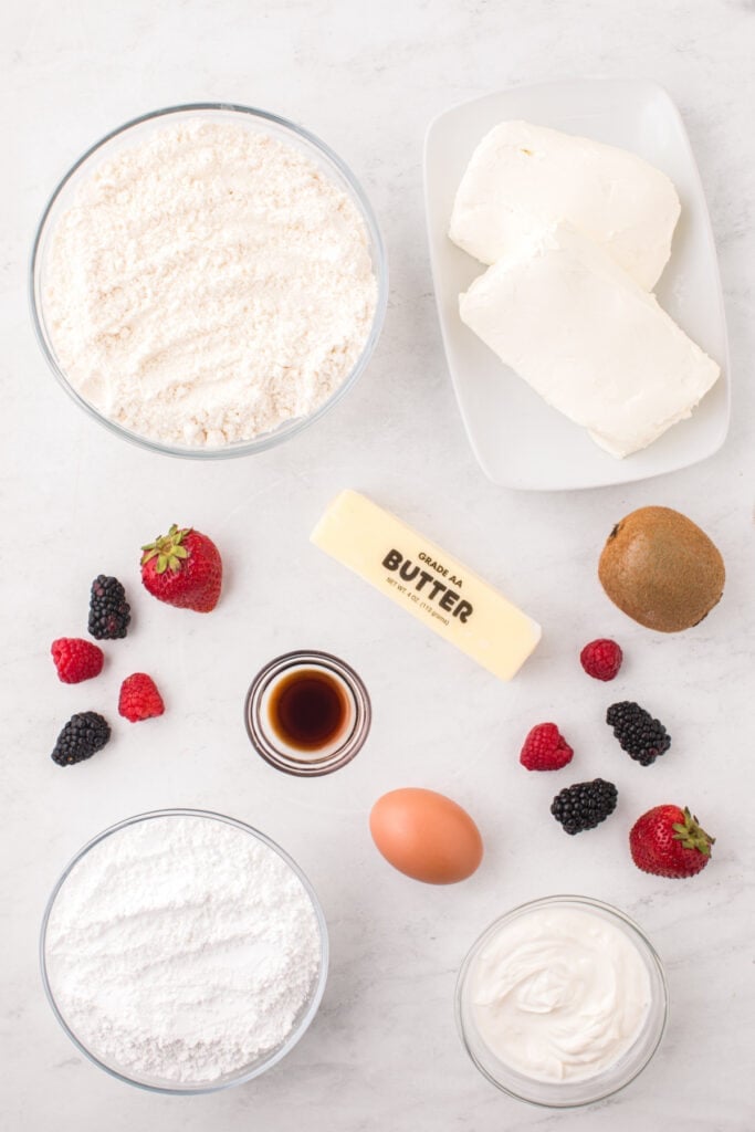 Ingredients needed to make Fruit Pizza Cookies arranged on a countertop.
