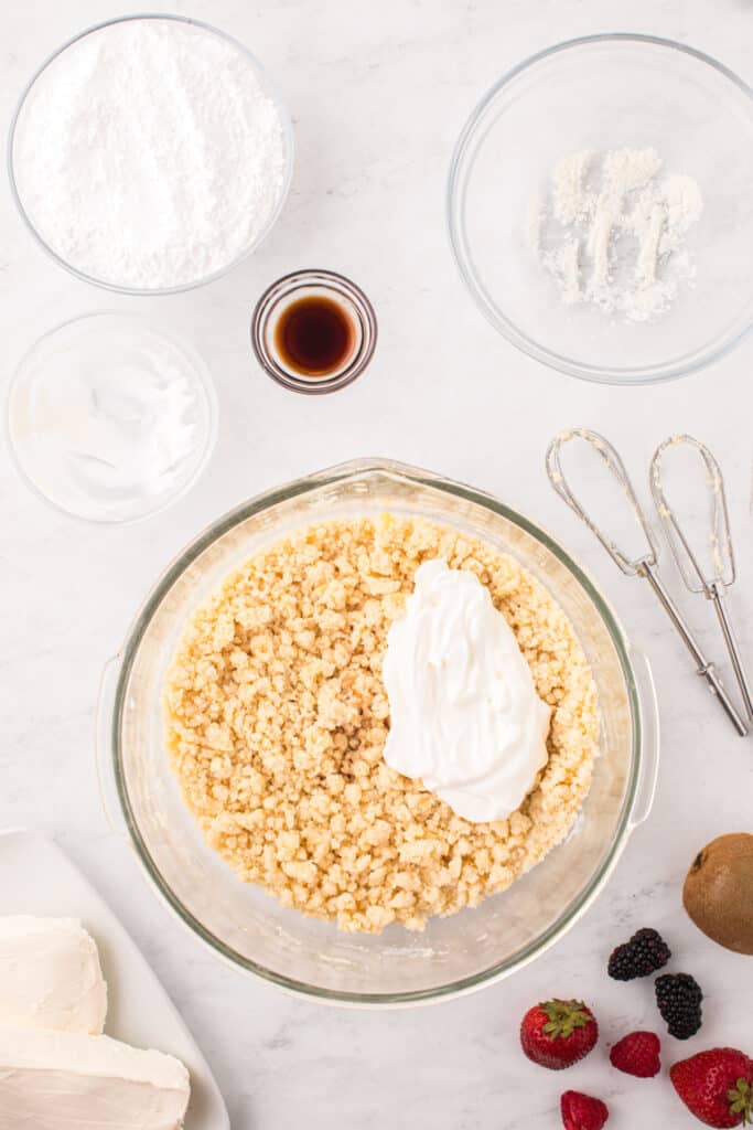 Sour cream added to the sugar cookie mixture before mixing.