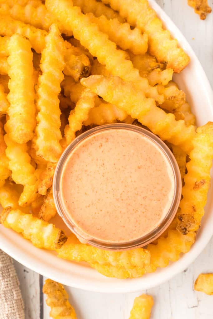 Overhead view of homemade Fry Sauce served with crispy crinkle-cut French fries.