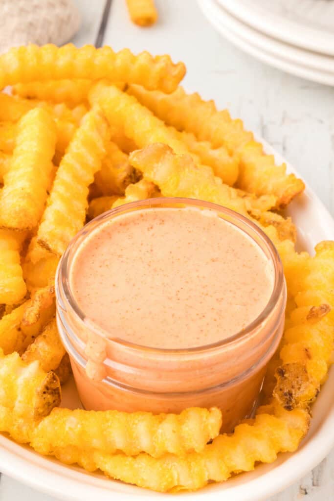 Creamy homemade Fry Sauce served with hot, crispy crinkle-cut French fries.