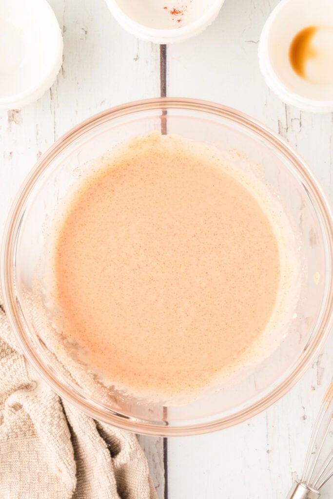 Homemade Fry Sauce whisked until smooth and creamy in a glass mixing bowl.