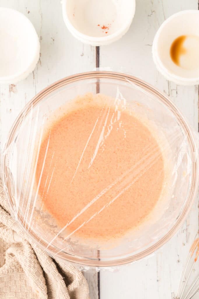 Freshly mixed Fry Sauce covered with plastic wrap before chilling in the refrigerator.