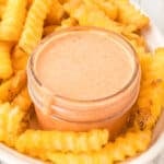Square close-up of homemade Fry Sauce with crispy crinkle-cut French fries.
