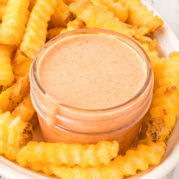 Square close-up of homemade Fry Sauce with crispy crinkle-cut French fries.