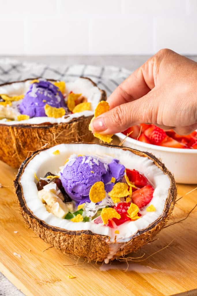 Topping Halo Halo with corn flakes.