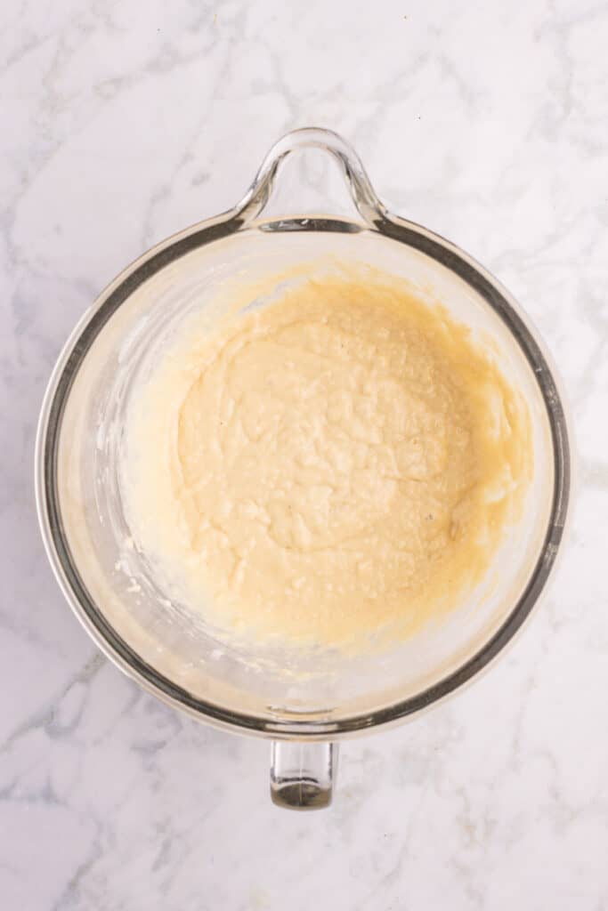 Homemade hamburger bun dough after mixing the wet ingredients before adding the remaining flour