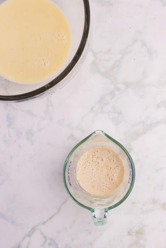 Bloomed yeast and warm milk mixture ready to combine for hamburger buns
