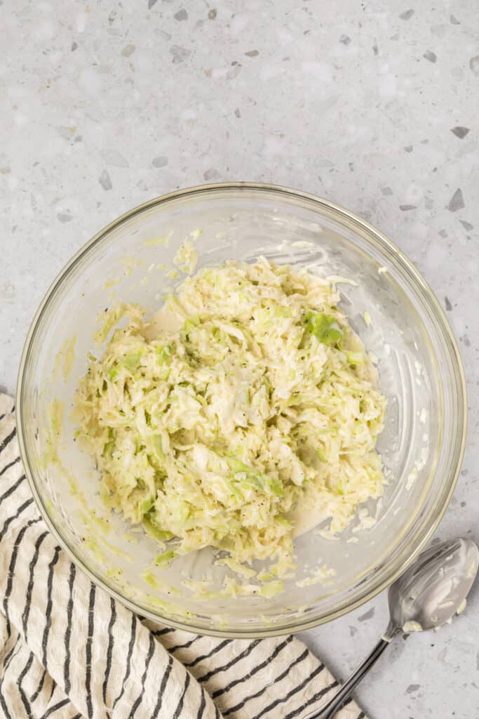Homemade Southern-Style Slaw tossed until evenly coated in the creamy dressing.