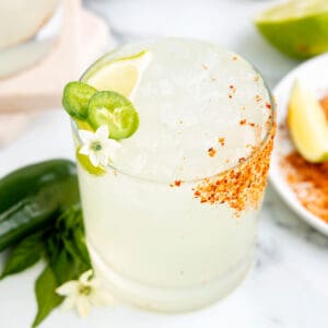 Best spicy margarita recipe made with blanco tequila, fresh lime juice, jalapeños, and a Tajín rim