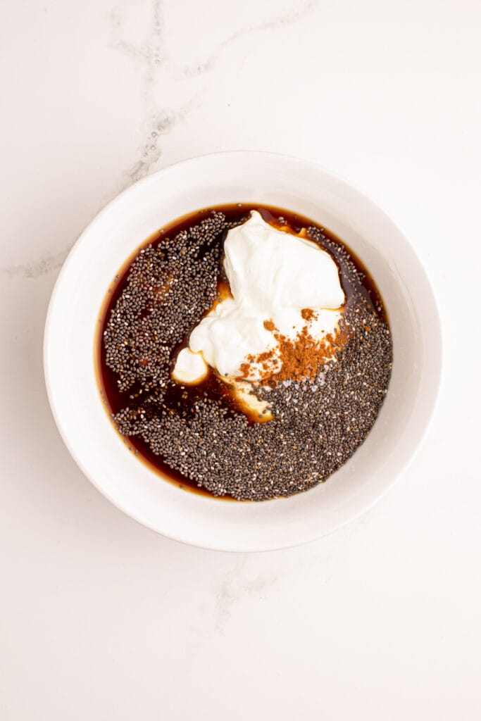 Greek yogurt, coffee, chia seeds, maple syrup, vanilla, and cinnamon combined to make Tiramisu Chia Pudding