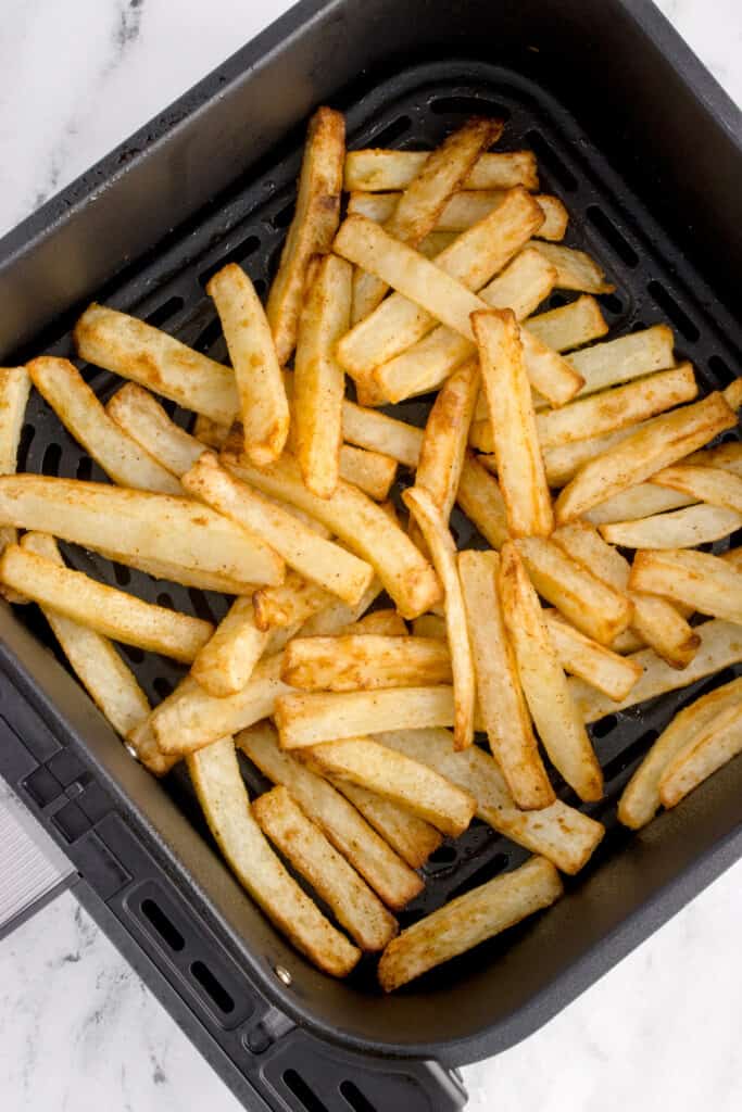 Crispy homemade French fries freshly cooked in an air fryer basket