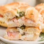 Baked Bagels & Lox Sliders stacked with smoked salmon, cream cheese, red onion, capers, and fresh dill