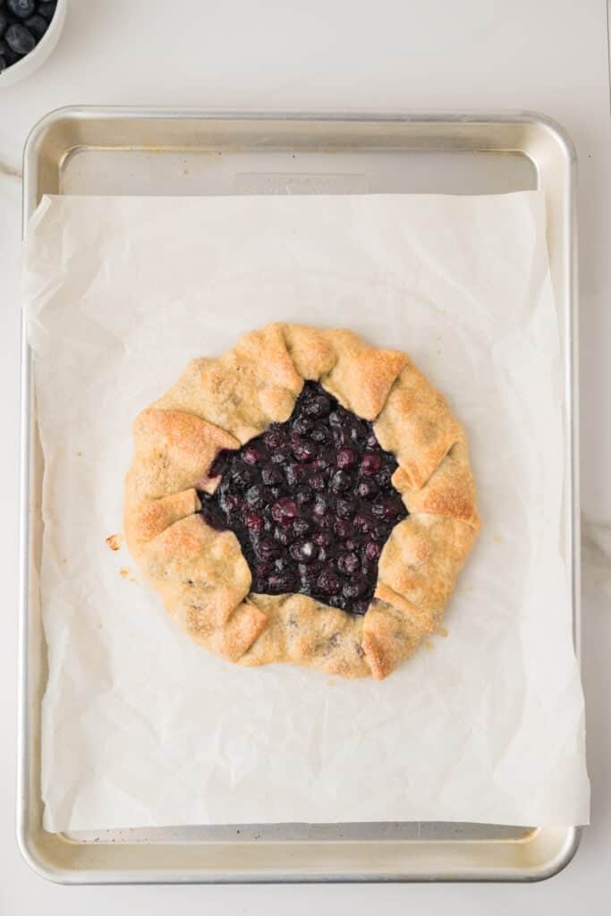 Freshly baked Blueberry Galette with golden folded crust and juicy blueberry filling