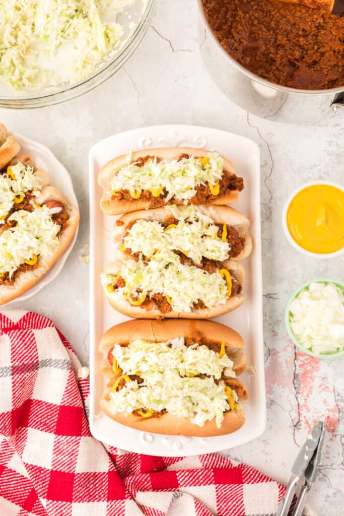 Carolina hot dogs topped with chili, mustard, and creamy Southern-style slaw.