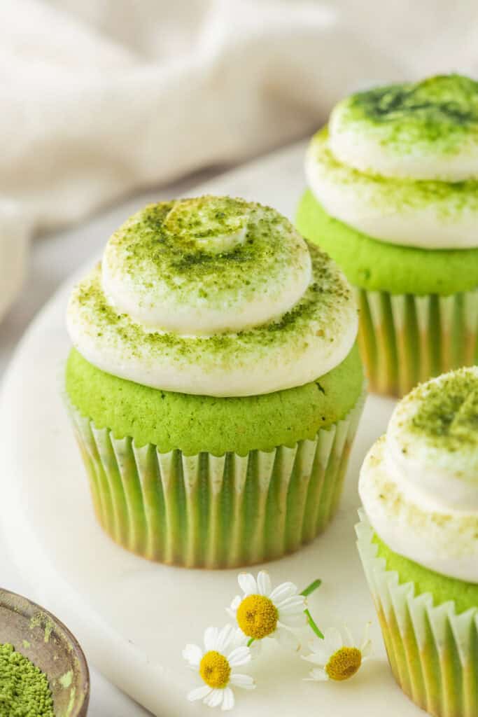 Close-up of a Matcha Cupcake with vanilla buttercream and sifted matcha topping