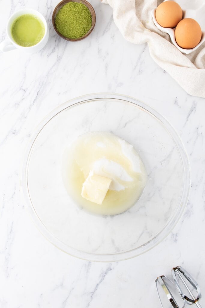 Softened butter, vegetable oil, and granulated sugar in a mixing bowl